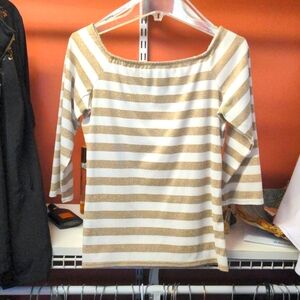 Top with 3/4 sleeve. Metallic gold strips.